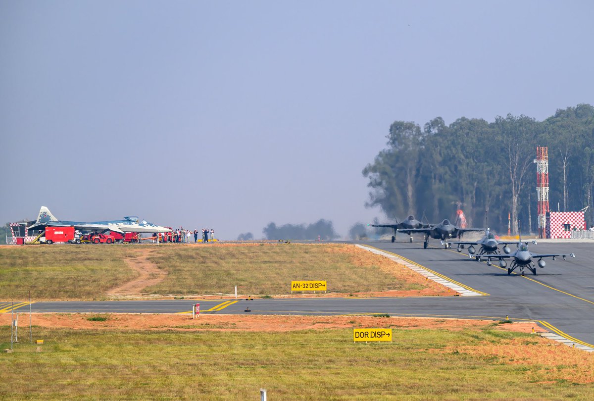 Livefist (@livefist) on Twitter photo Sensational picture here by <a href="/severerocket/">Aatish Pillai</a> of Su-57 crew with their cameras out filming the arrival of the American fighter pack at #AeroIndia2025. โฅ๏ธ๐ฅ Sensational picture here by <a href="/severerocket/">Aatish Pillai</a> of Su-57 crew with their cameras out filming the arrival of the American fighter pack at #AeroIndia2025. โฅ๏ธ๐ฅ