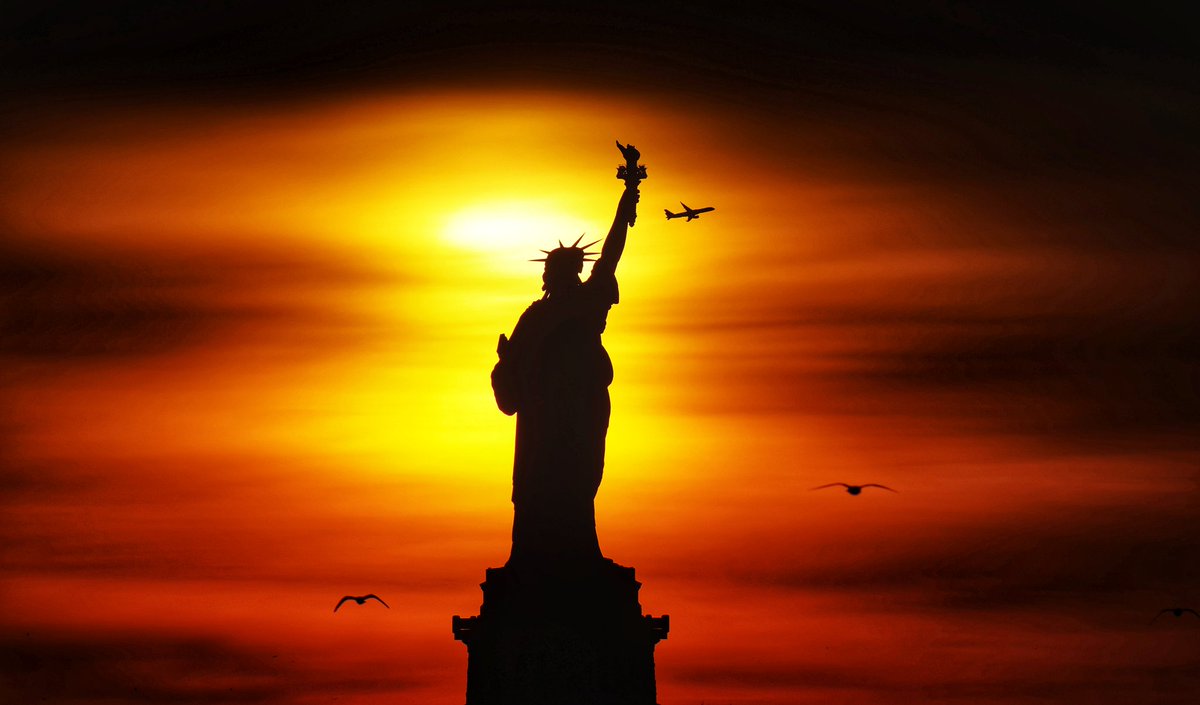 GaryHershorn's tweet photo. The sun rises behind the Statue of Liberty in New York City, Saturday morning #newyorkcity #nyc #newyork #statueofliberty @StatueEllisFdn #sunrise https://t.co/Iohq75SqSr