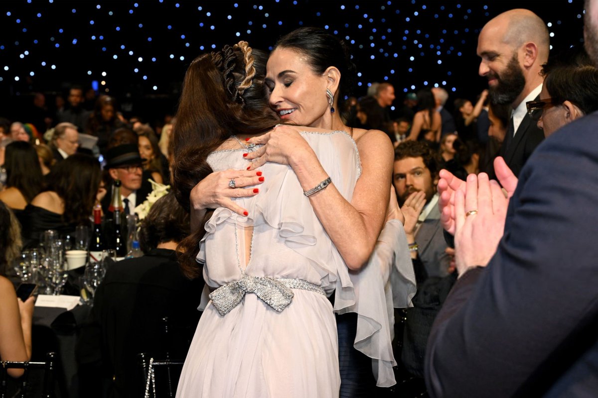 Margaret Qualley hugging Demi Moore, who won the Best Actress award for "The Substance" during the 30th Annual Critics Choice Awards.
