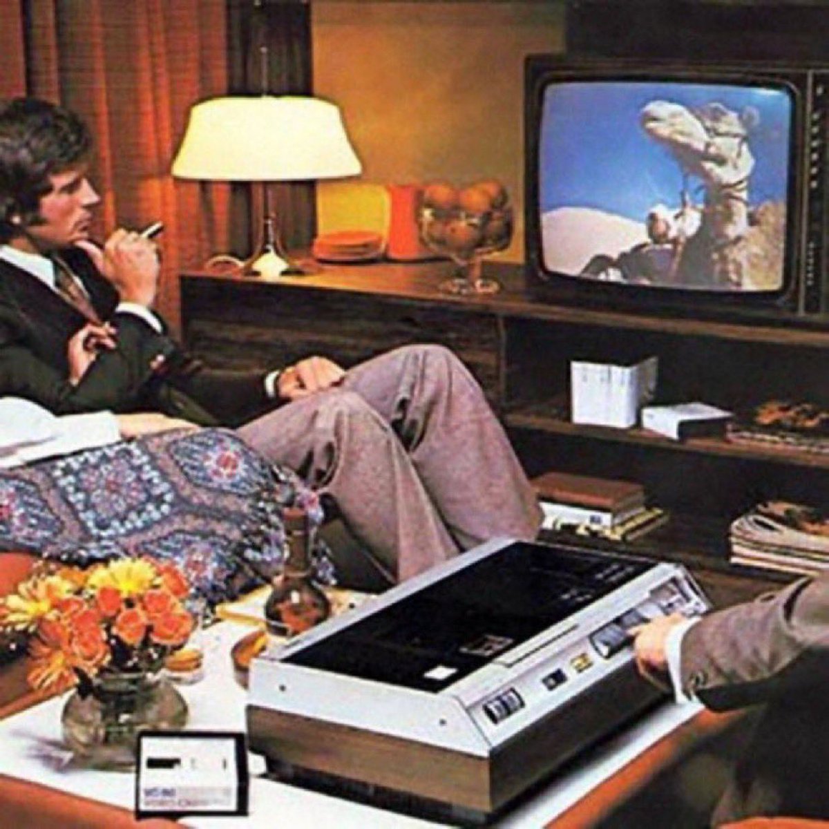 Super70sSports's tweet photo. Trust me when I say that heating up a lung dart with a fine lady on your arm while watching a documentary about camels on your $8000 VCR was peak 1975 living. https://t.co/OD5nqEyF3m