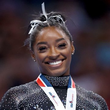Simone Biles unpacking suitcase - item 1