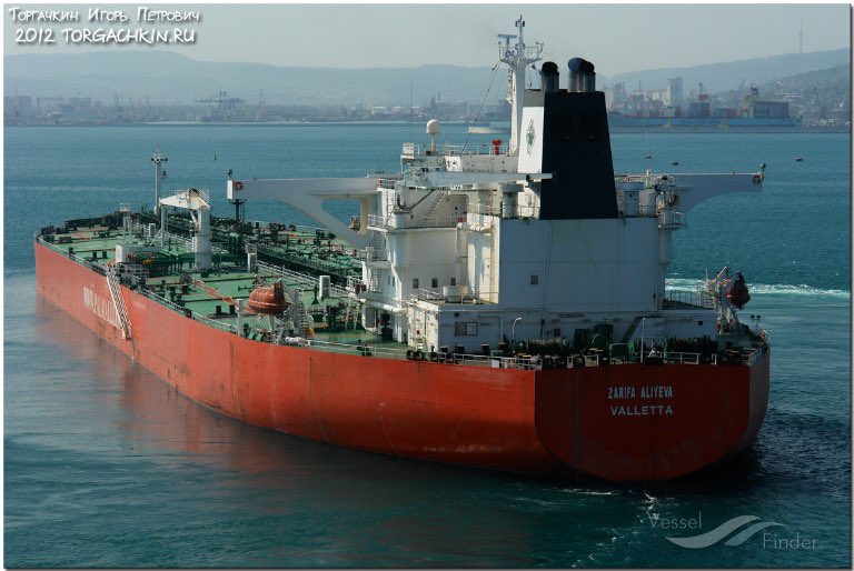 bayraktar_1love's tweet photo. KOALA Crude Oil Tanker, IMO 9234642
 with 130,000 tons of Russian fuel oil is sinking in a port in the Leningrad region of Russia. Preliminary, several explosions occurred in the tanker's engine room, after which the vessel began to fill with water.

On the night of February 9, the tanker “Koala”was at the third berth in the Russian seaport in Ust-Luga. On board the tanker was a crew of 24 people (including four Russians, eight Georgian citizens and 12 Indonesians).

Closer to two o'clock in the morning, about 130,000 tons of fuel oil were loaded on board the tanker. The vessel was already preparing to sail, when three powerful explosions thundered in the engine room. The crew managed to get ashore, but the ship's engine room began to flood with water.

Closer to 5 a.m. it became clear that the ship had run aground stern-first. The Russian Emergencies Ministry staff installed booms around the ship. However, according to preliminary data, there was no leakage of oil products into the water. No one was hurt as a result of the incident.