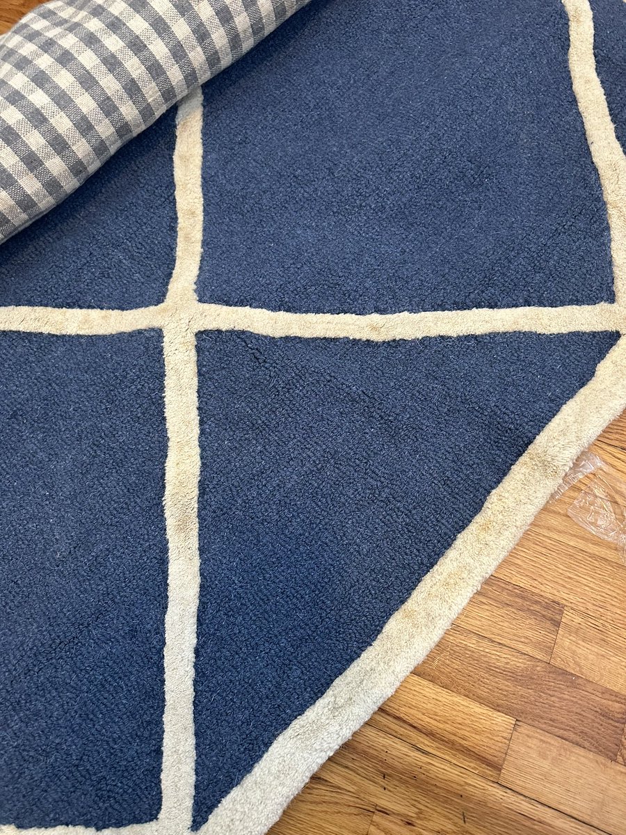 ZachHartley14's tweet photo. @BedBathBeyond my pregnant wife and I get sent a stained rug for our babies room. Customer service tells us we have to pay for FedEx to rewrap and ship this back to get a new one. How is this on us to pay to return a damaged item? This is unacceptable. https://t.co/PfUAqs1Gop