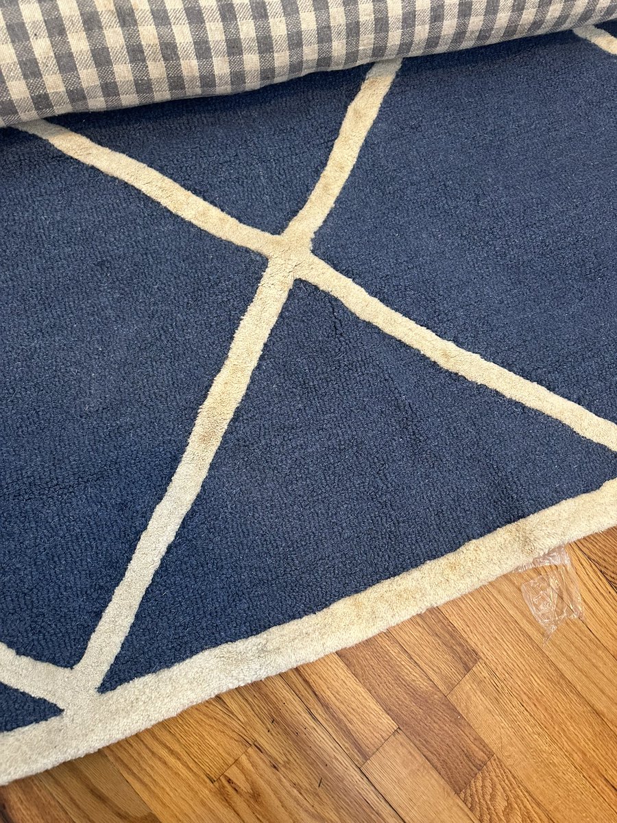 ZachHartley14's tweet photo. @BedBathBeyond my pregnant wife and I get sent a stained rug for our babies room. Customer service tells us we have to pay for FedEx to rewrap and ship this back to get a new one. How is this on us to pay to return a damaged item? This is unacceptable. https://t.co/PfUAqs1Gop