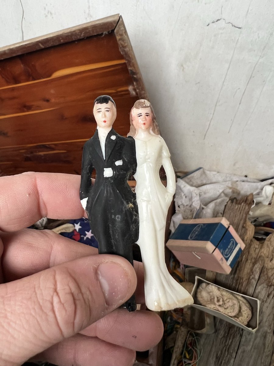 Wedding topper found in a cedar chest. The #abandoned house rotted around the chest but everything inside was preserved and #forgotten.