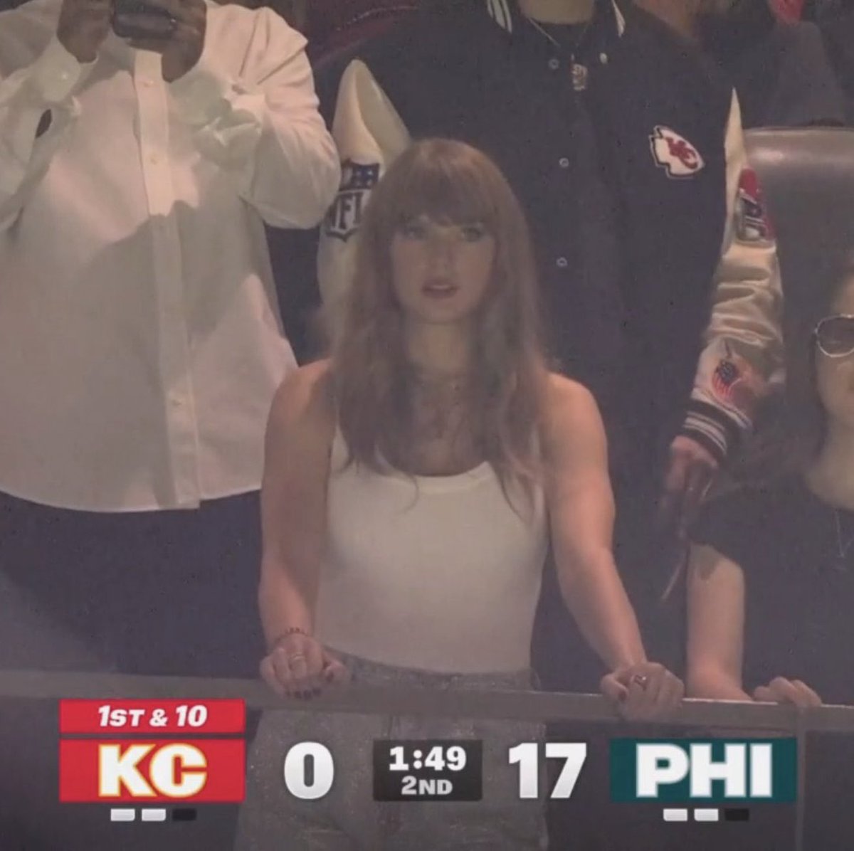 professor watching her advisees on the job market