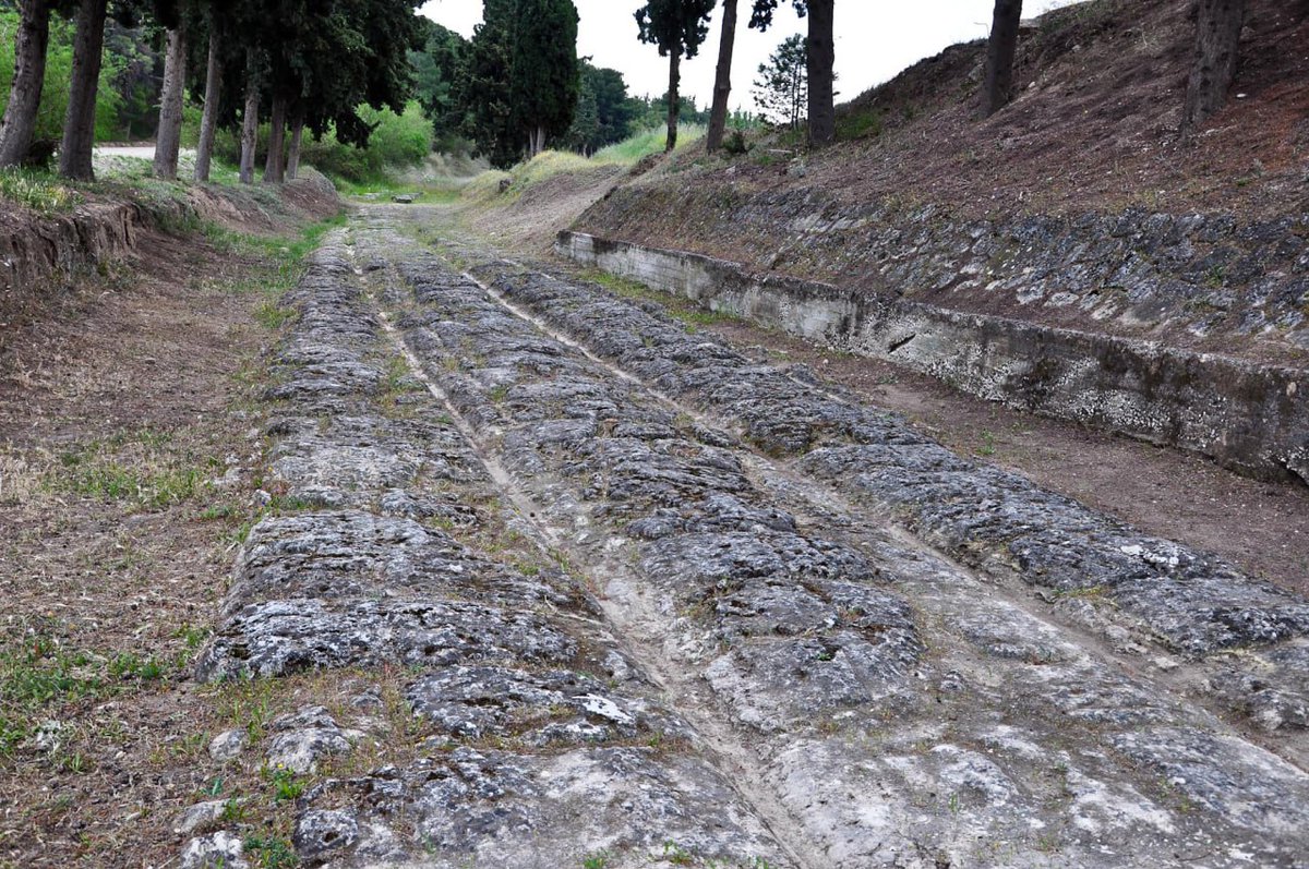 The Incredible "Iron" Road of Antiquity – The Diolkos

In the 6th century BC, the Greeks shortened the route between the Ionian and Aegean Seas from 400 km to just 6–8.5 km by constructing a stone-paved road across the Corinth Isthmus, used to transport goods and entire ships.