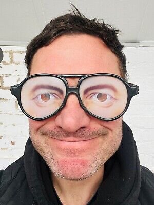 Why does the guy on the right look like hes got a pair of these joke glasses on ha