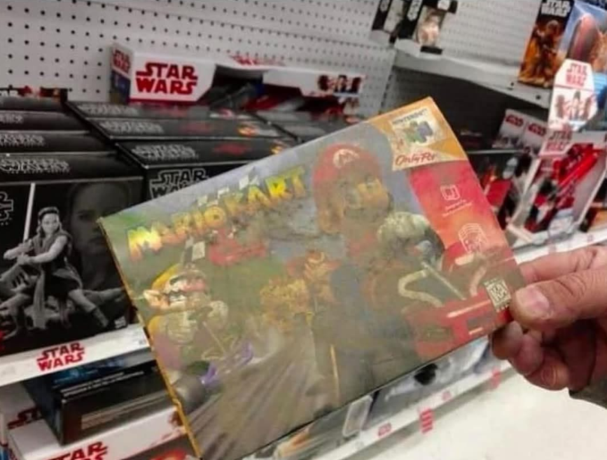 VideoGameHstry's tweet image. A Toys "R" Us employee found a boxed copy of Mario Kart 64 hidden under their shelves