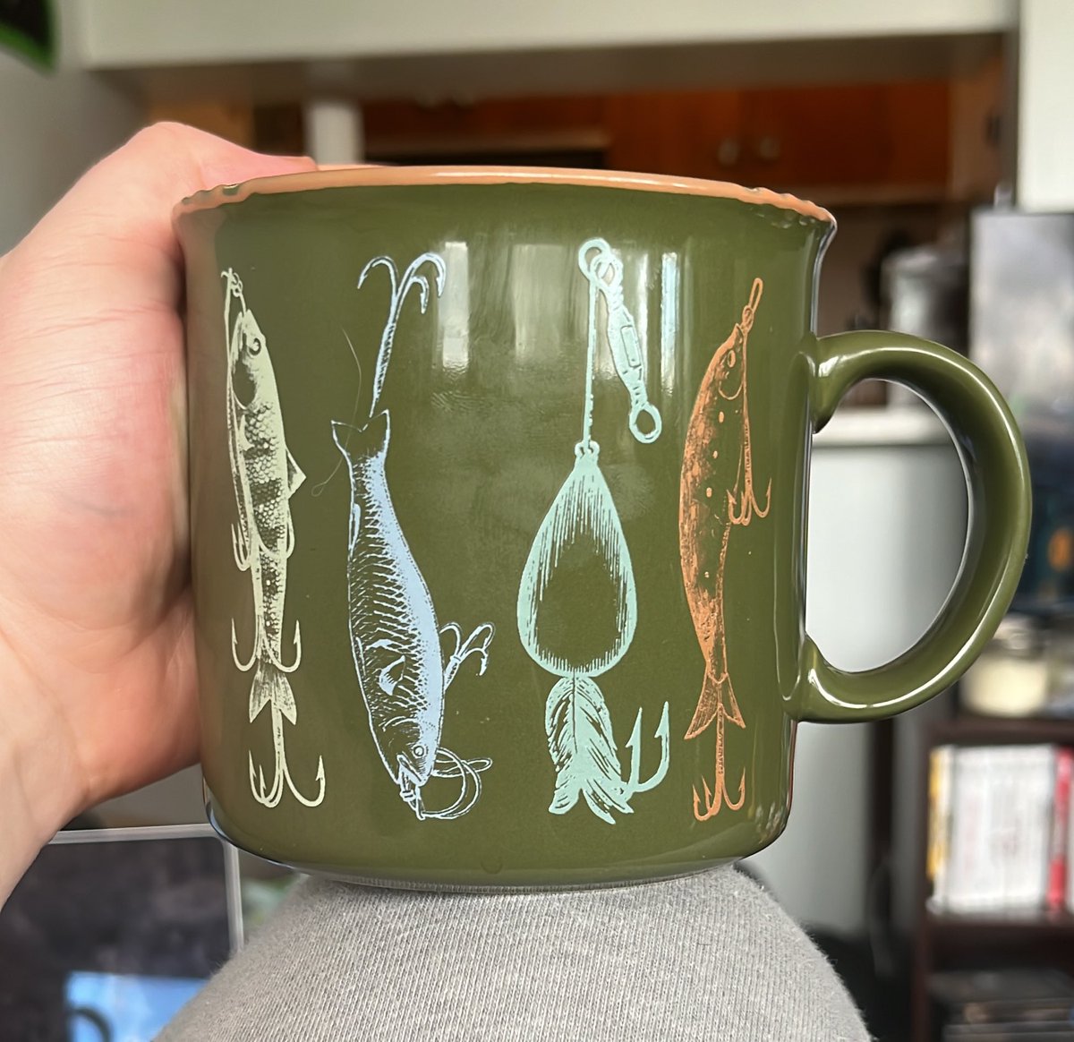 average__frog's tweet image. Made mocha with marshmallows drinking it out of my fish lure mug