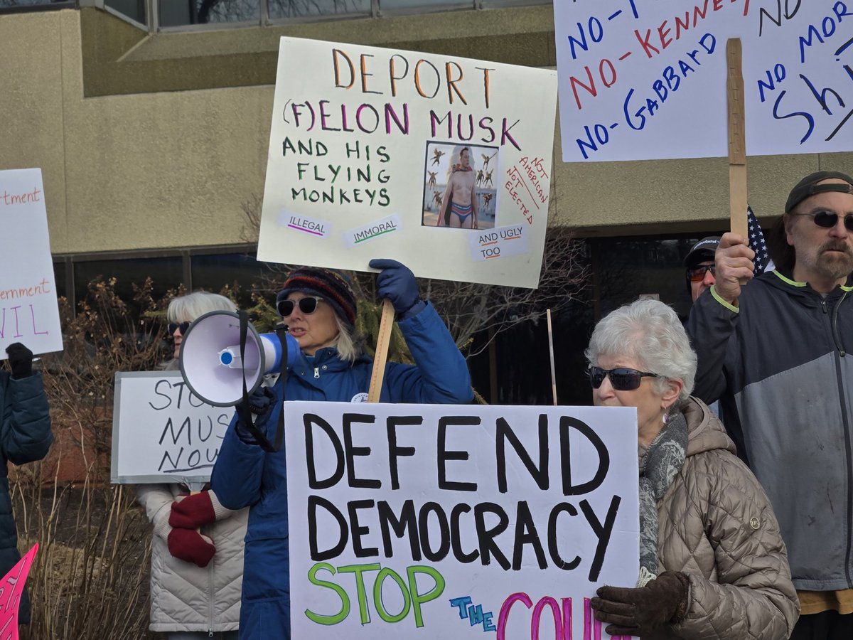 Activists protest outside the offices of Rep. Darin LaHood.