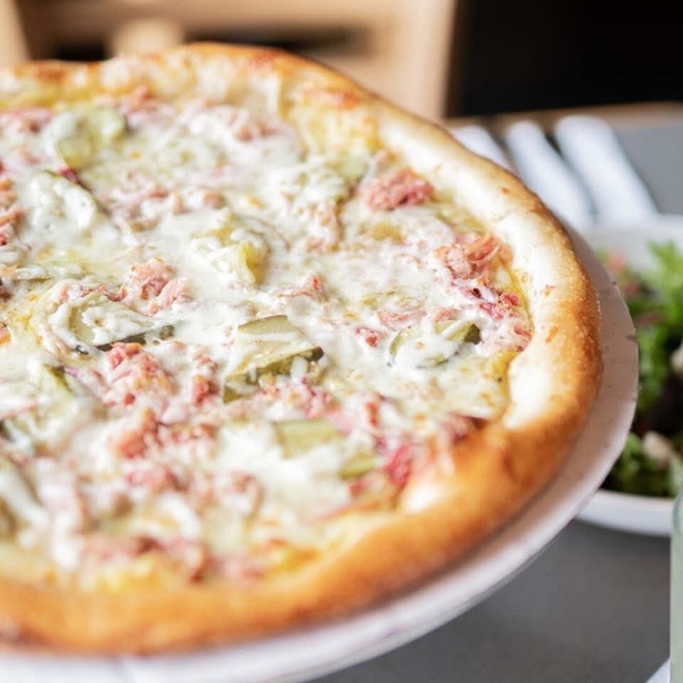 The Cuban is back for a limited time! It's a dill-icious combo featuring pulled pork and pickles, inspired by a Cuban sandwich. 🥒 Try it today at deweyspizza.com
