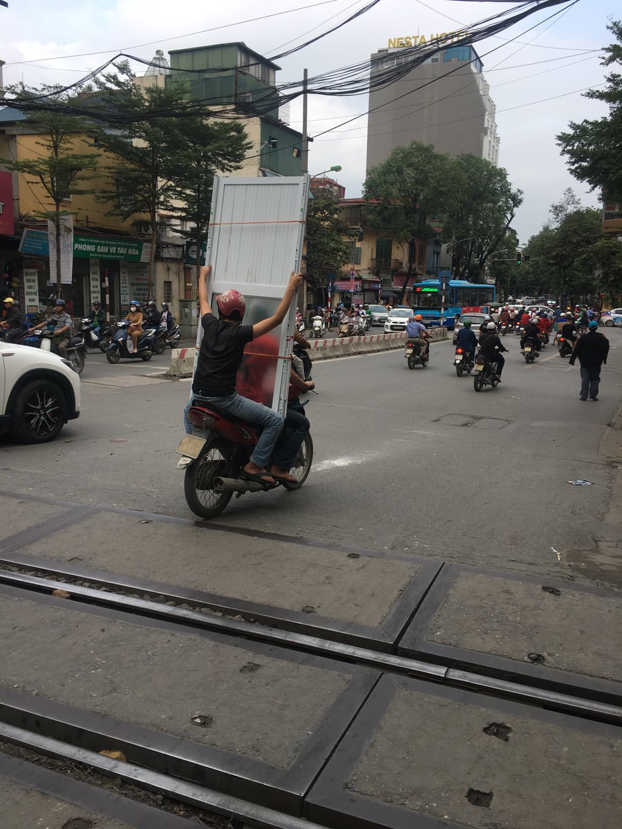 So, marketing bods, what would your customers think if your business delivered your doors on a bike? I took this in Vietnam, and yes, it was a glass panel door, and yes, they were weaving through the traffic. #marketing #branding #deliveries #doors #windows #fenestration
