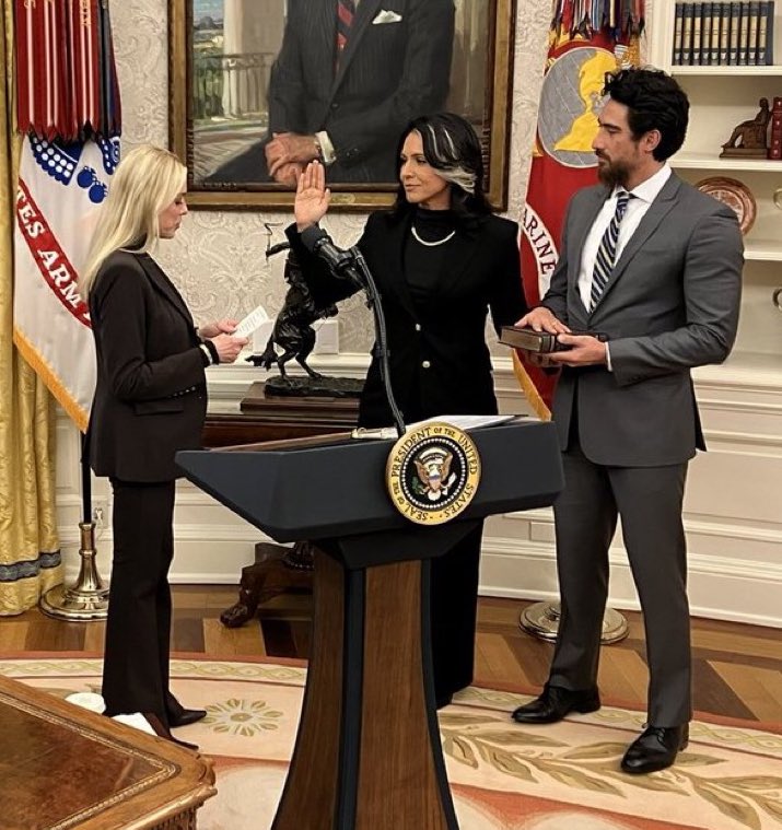 stclairashley's tweet image. Tulsi going from the innocent all white look for the hearings to all black Dark MAGA aesthetic for confirmation is exceptional