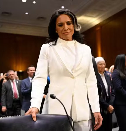 stclairashley's tweet image. Tulsi going from the innocent all white look for the hearings to all black Dark MAGA aesthetic for confirmation is exceptional
