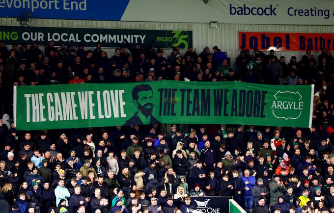 A banner that says "The game we love, the team we adore.