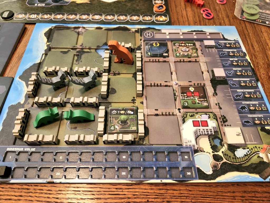 What's better than building Jurassic Park? Competing to see who can build the best Jurassic Park! 

Dinogenics by <a href="/NinthHavenGames/">Richard Keene</a> is the best dinosaur park game out there (a surprisingly crowded field).  Amazing production and super thematic game play.