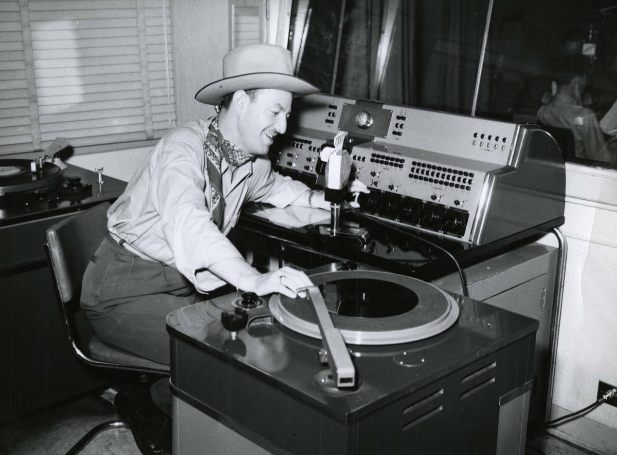 #TBT photo of a radio DJ at CKRC around 1955. Today is #WorldRadioDay so be sure to tune in! Photo by Harold K. White. See more photos at #WpgArchives bit.ly/48MOT5u