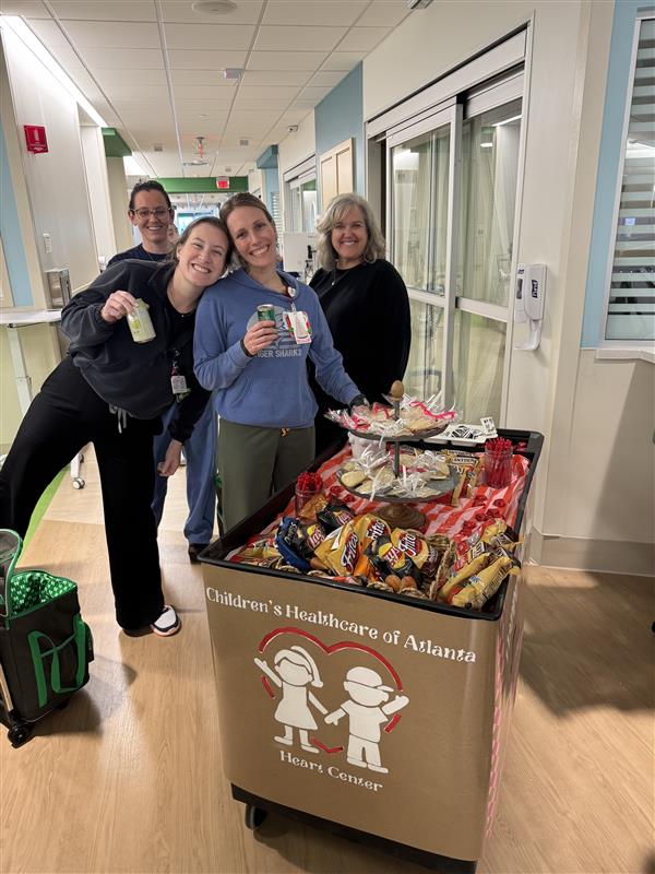 childrensatl's tweet image. The Heart Center staff and facility dog, Pepa, celebrated #CHDAwarenessWeek with a spirit cart—lifting spirits and delivering goodies to our patient families! #HeartMonth