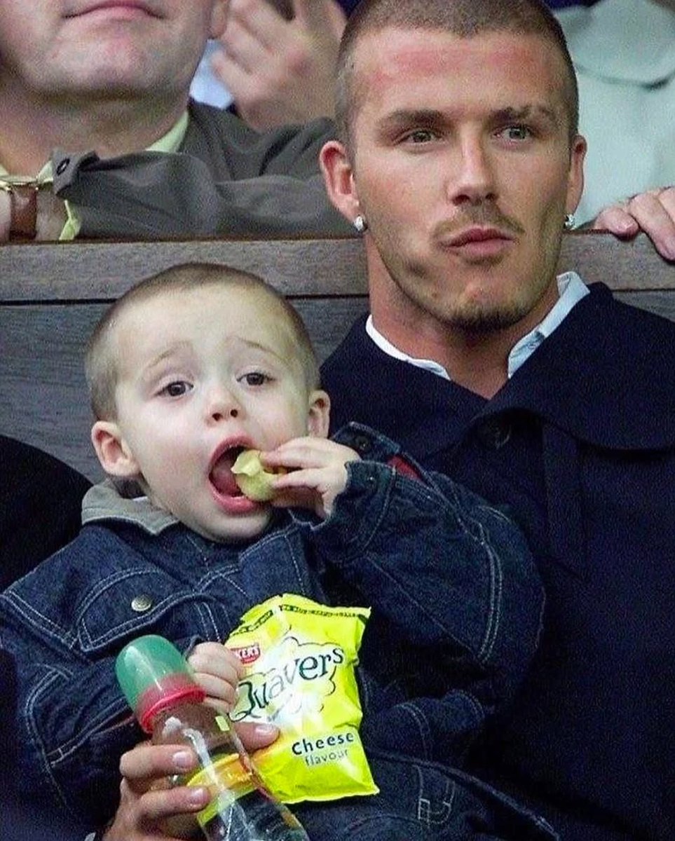 pedestrian's tweet image. David Beckham with his son Brooklyn at a football match (2001)