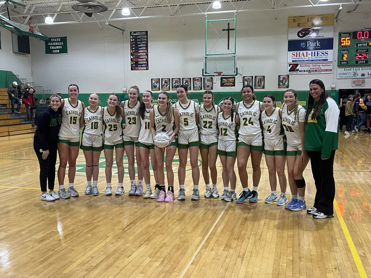 Sophie Peloquin presented with the game ball for surpassing 1,000 career points during Newark Catholic’s 56-46 victory against Mechanicsburg in the Division VI tournament opener