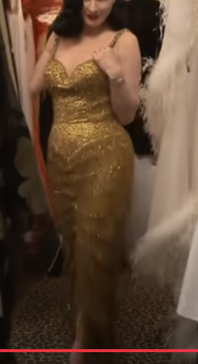 Im pretty sure Addison Rae in the High fashion music video is wearing a gold  fringe dress once owned by Burlesque icon Gypsy Rose Lee, and i think is  currently owned by