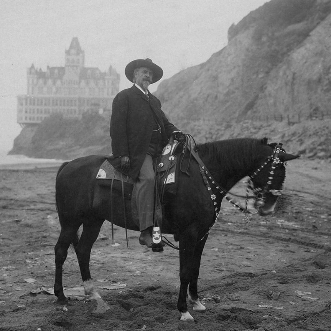 CowboyGospeler's tweet image. Buffalo Bill Cody on the beach with the San Francisco  Cliff House in background. Cody and his Indians were 'dined and soda watered' at the Cliff House. The show reenacted the Battle of San Juan Hill were Indians doubled as Spaniards and cavalry soldiers recreated their charge.🧵