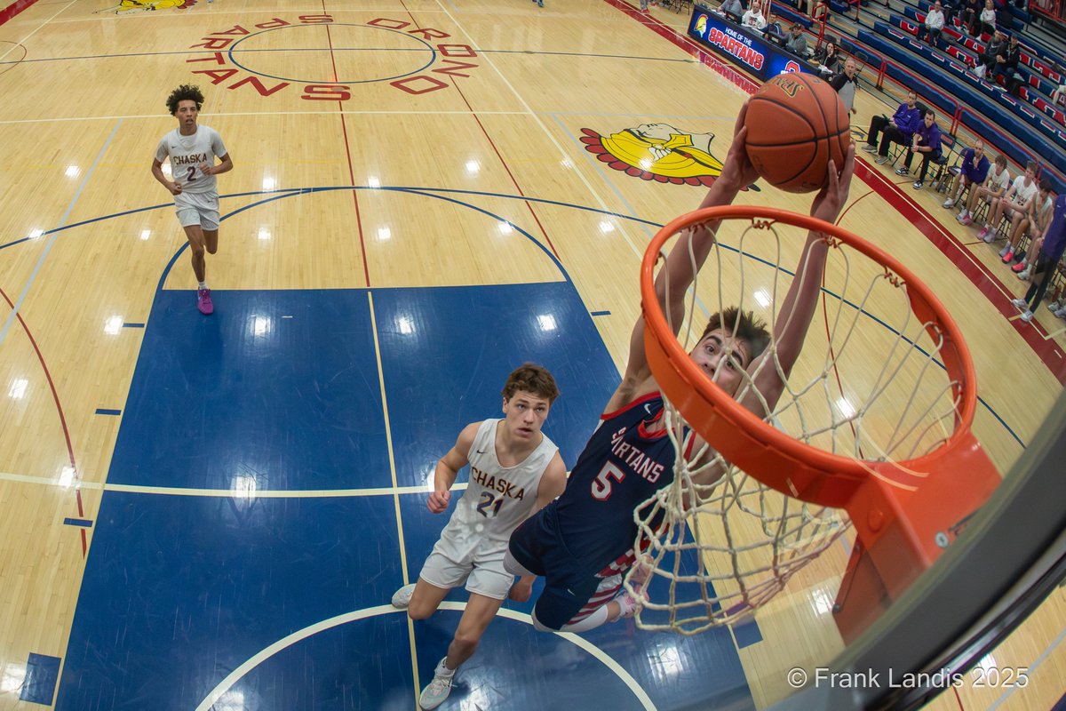 An amazing night for a high school basketball game. Chaska versus Orono. Before the game began, there were several festivities. The players thanked their parents for their support over the years. Barry Wohler, Orono's coach, gave Noland Groves commemorative basketball for