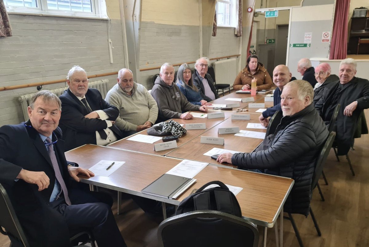 MittensOff's tweet photo. Rupert Lowe from #ReformUK joins a typically diverse Parish Council meeting at Caister-on-Sea to stop new housing for people who need it. A poster for why planning rules have to change. https://t.co/Dqk2cUhm8e