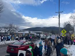 PaulRudnickNY's tweet photo. Vance is taking a ski vacation in Vermont after only 6 weeks in office. He was greeted  by thousands of protestors and signs like this, so he had to change luxury hotels. While President Zelensky returns to his war-torn country https://t.co/iTfA7CO535
