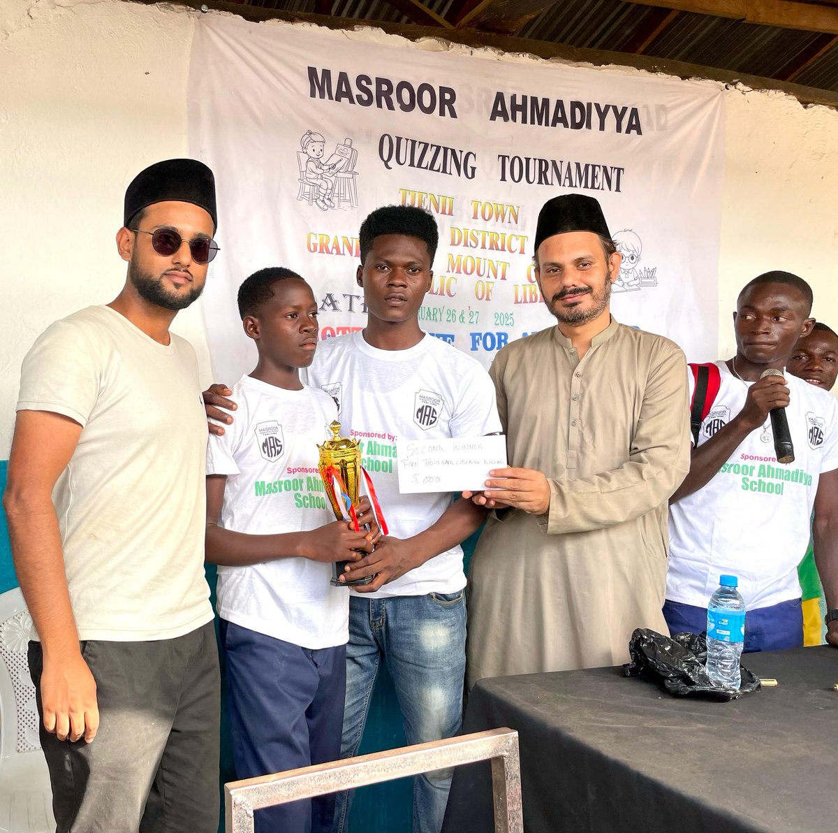 AMJ_Liberia's tweet photo. On Feb 26th, 2025, Masroor Ahmadiyya School in #Tienii hosted the District Quizzing Tournament in partnership with the Tewor DEO. Masroor Ahmadiyya School secured second place with a trophy and 5,000 Liberian dollars. #ahmadiyya_liberia #MAS https://t.co/izZN6yyGBO