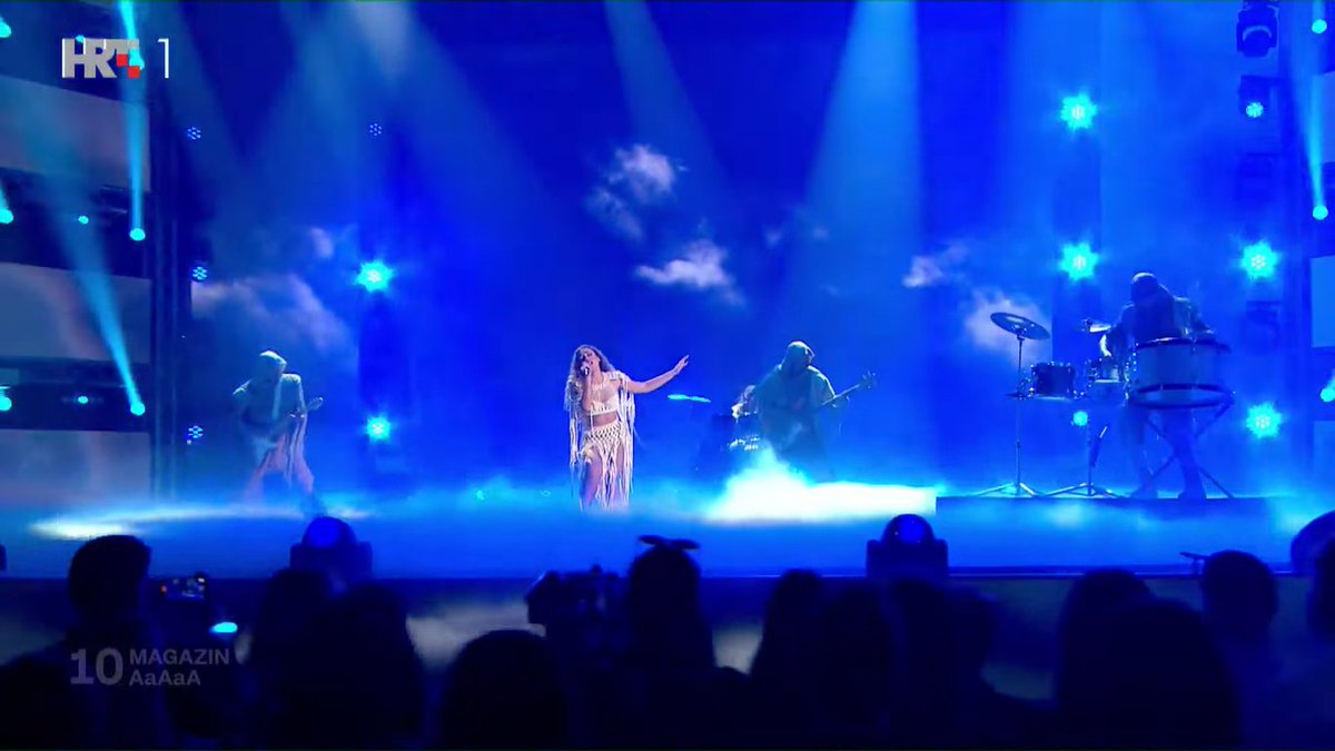 markovodokutlic's tweet photo. magazin is NOT winning, what the hell is this lmaooooooo

horrible setup with the guitarists and the drummer, cringey AI graphics... they tried to make an epic rock ballad performance but this was just hard to watch.

ogenj and luka are absolutely outperforming this! #dora2025 https://t.co/MxAIXLWLd8