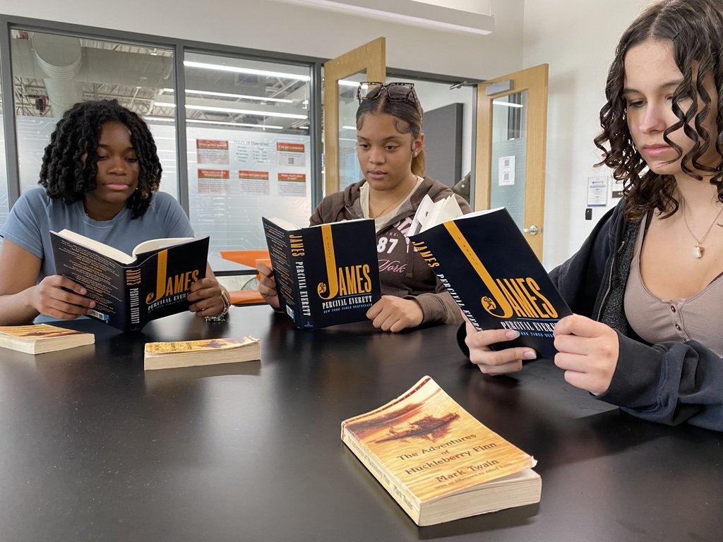 MCHSDurhamTech's tweet image. English 3 Honors uses Percival Everett&apos;s &quot;James&quot; to offer a dual perspective, reimaging of Huck Finn. &quot;Jim is so smart,&quot; students quickly notice. Thanks to #RogueBookClub for lending us these exciting books.