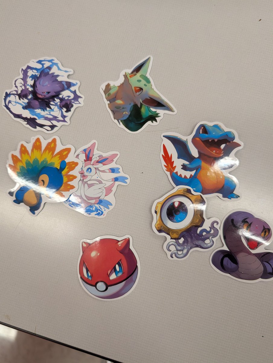 Foxxifye's tweet image. Work made a pokemon day display complete with very fake stickers. Some of them actually look pretty good tho