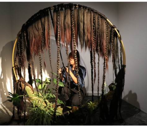Artist Fadwa Bouziane pays homage to the ritual of hair braiding among Black people and communities in "Hair-Itage." See more: moyamagazine.com/content/hair-i…