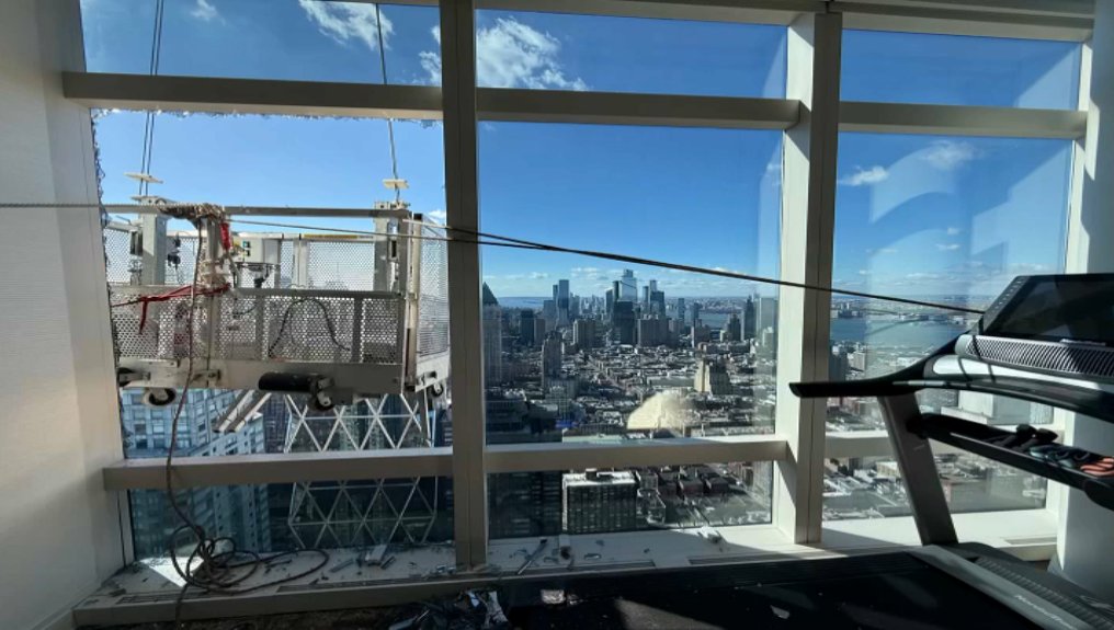 BREAKING:  A high rise rescue 78 floors up.  FDNY firefighters pull two window washers to safety after their wind-tossed scaffolding smashed into the building #nbc4ny