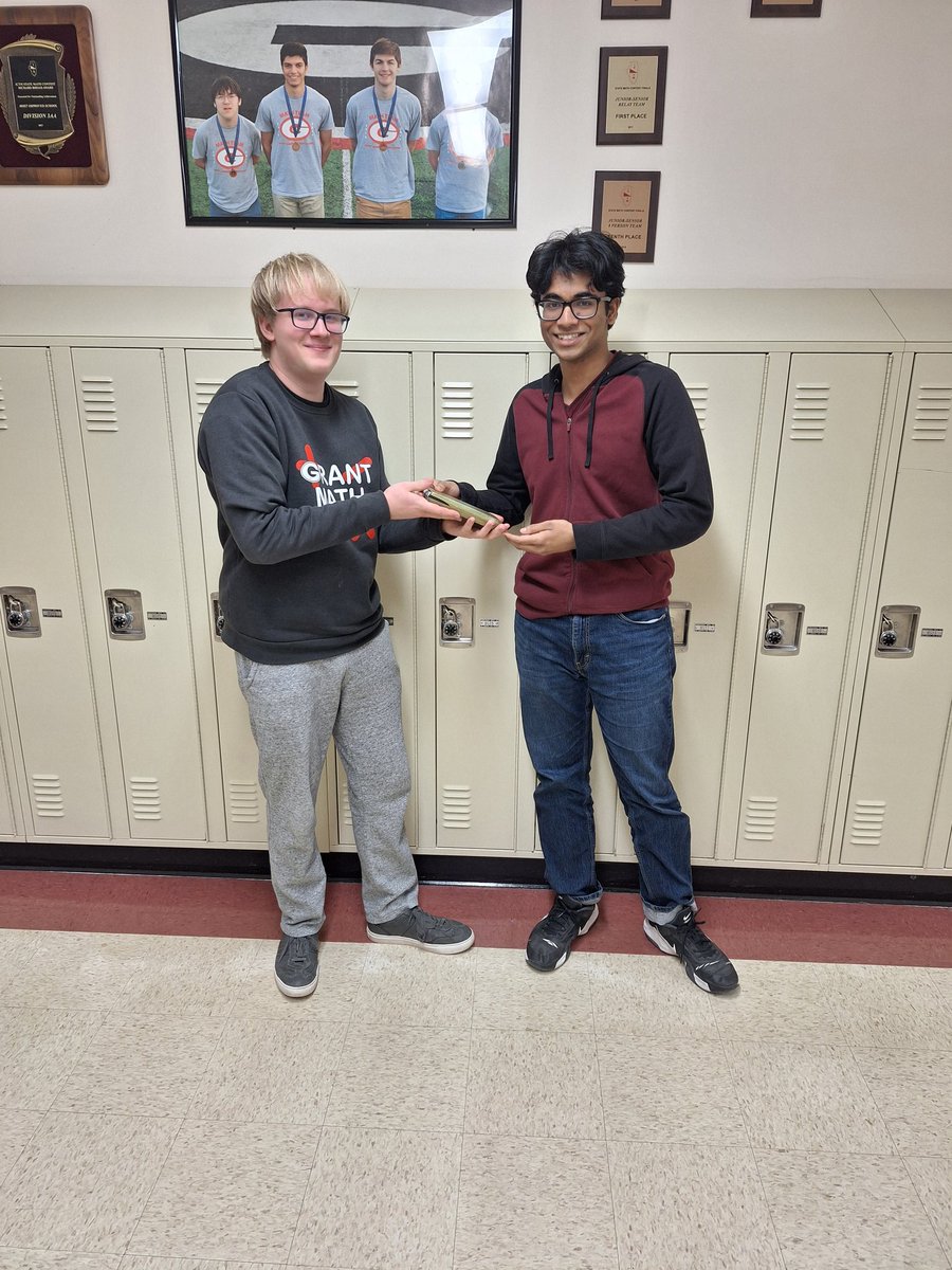 Evan Weisheit (L) presented Taiseer Mumin (R) with the Golden Calculator for his recent performances and his creation of the "Taiseer Sheets"!