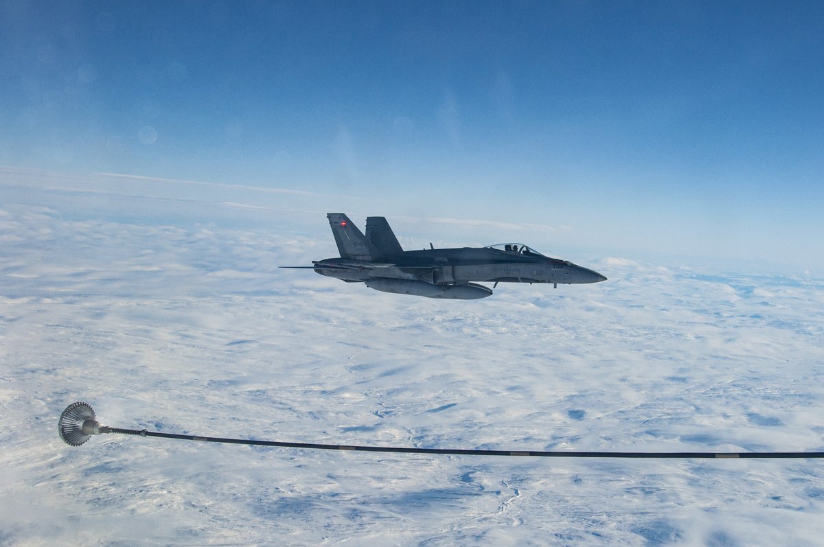 RCAFOperations's tweet photo. Feb 3, @RCAF_ARC CF-18s and a CC-150 conducted air-to-air refueling over the #Arctic during Op #NobleDefender, contributing to #CANR’s critical role in safeguarding North America and ensuring rapid response capabilities in the Arctic. #WeHaveTheWatch @NORADCommand #NORAD https://t.co/YIz5hFdNx8
