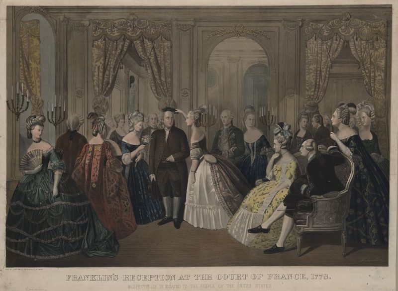 Benjamin Franklin wearing a coonskin cap while being received by the French court. "Proper" attire at the time would have been a powdered wig, but Franklin enjoyed playing up his "rustic" American identity. On these trips, he asked for military support for newly independent US.