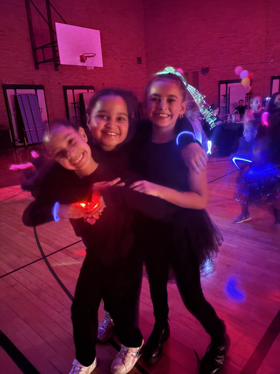 Primary students invite their special guest to the Glow in Dark dance with your hero party. Thank you, PTA for a wonderful time.