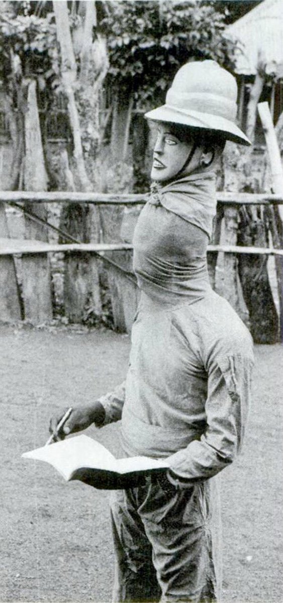 OziIkoro's tweet image. Onye Ọchá [white person] mask from Amagu Izzi, northeastern Igbo. The masker satirizes a white man, complete with a notepad and pen, mimicking a ‘researcher’ eagerly observing the crowd and taking notes, much to the amusement of the spectators. Photo by Herbert Cole, 1982.