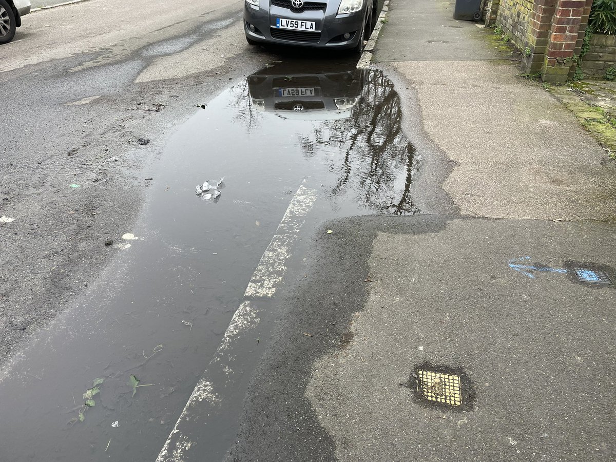 Leak outside 59 Granville Park, Lewisham <a href="/thameswater/">Thames Water 💧</a> been here for weeks. Water bubbling up in the road by the kerb