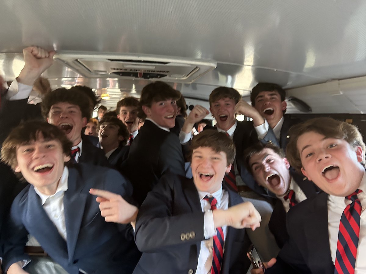 Is this the choir on its way home from earning all superior ratings from a panel of judges? Or is this the spirit bus getting an early start to tonight's basketball playoff game? Could really be either.