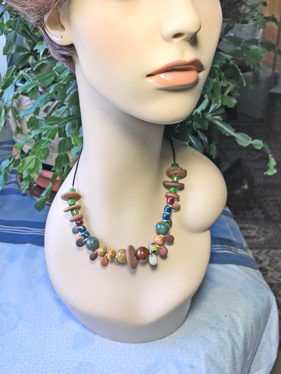 hvaradhan's tweet image. Nature-inspired Necklace, Artisan made natural polished River Rocks and handmade Ceramic Beads, Light weight Adjustable Brown Leather Cord #StoneBeads #MultiShapeBeads 
$36.00
➤ etsy.com/listing/735910…