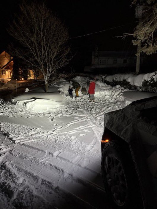 Tesla, cybertruck lighting up the night after a snowstorm in northern Canada. Helps with the late night excavation. ❄️ ⛄️