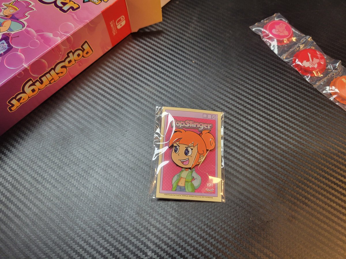 VGNYSoft's tweet image. Next up is the enamel pin of #PopSlinger protagonist&apos;s, Ria Carbon, head. Looks like being tasked with saving the world alongside her sunny disposition has went straight to her head. It&apos;s a big job that you can experience by getting a copy of the #ExtraEdition of PopSlinger!