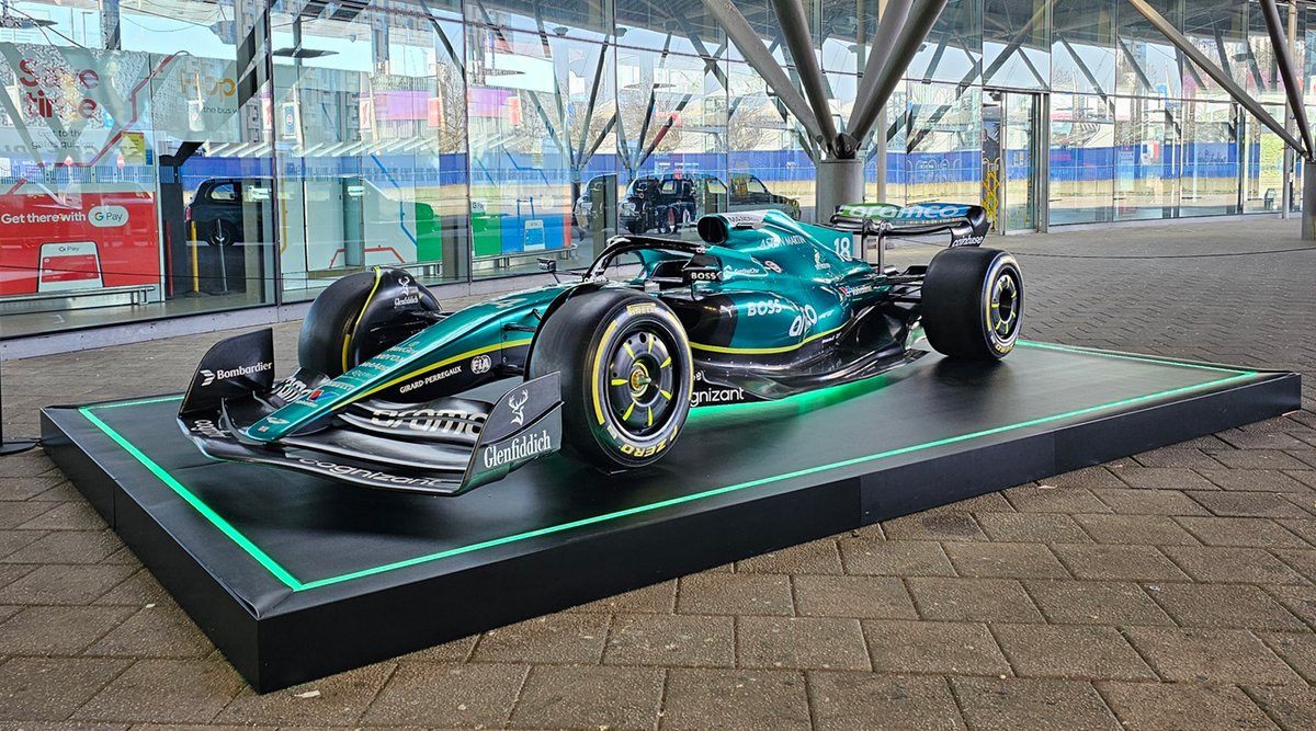 ianvisits's tweet photo. See an Aston Martin Formula 1 racing car at North Greenwich tube station

 https://t.co/xPrdsSnsmj 

If you head to North Greenwich tube station today, you can see a very smart-looking rail replacement bus service—in the shape of an Aston Martin racing car. https://t.co/HjQqp5thpl