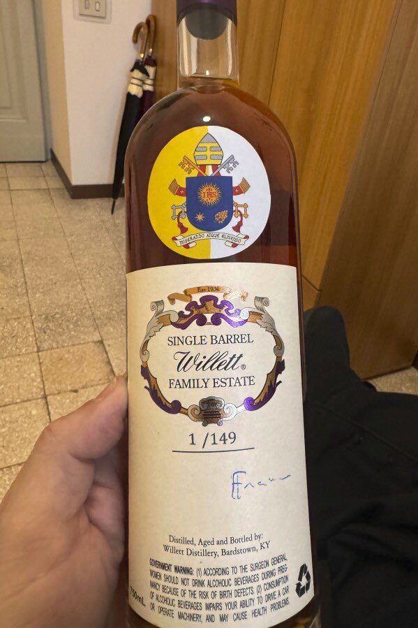 bootkeg's tweet photo. Literally holy spirits. In a twist no one saw coming, two Kentucky bourbon bottles signed by POPE FRANCIS just raised $30,000 for charity. Photo credit Jim Sichko via AP News. #holyspirits #PopeBourbon #BlessedByTheBarrel #BourbonMiracle #bourbon https://t.co/wULg8zolU5