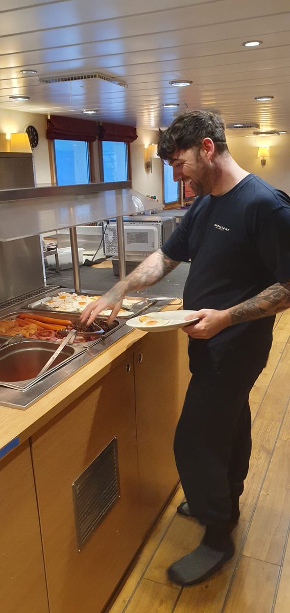 GreatBritFish's tweet photo. 🚢 #KIRKLOG: A break for breakfast for Mark Gibson before going back to the factory to finish processing the catch. https://t.co/BdRUhGlXd5