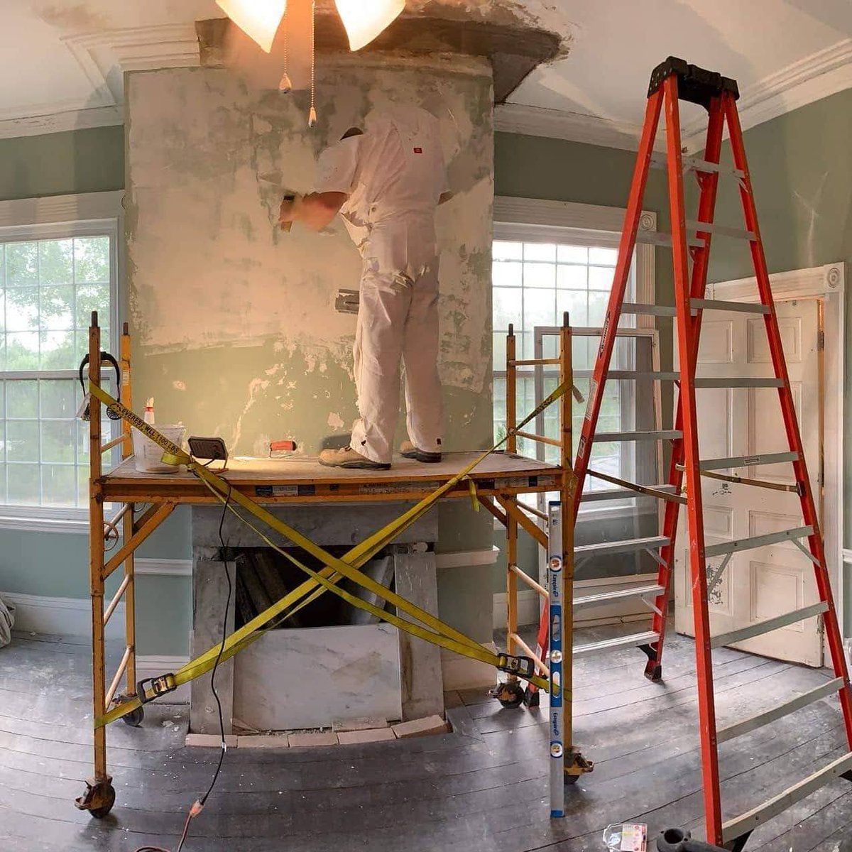 JSADLLC's tweet image. Skim coating the wall to alleviate the uneven surface. Rockwell house.